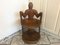 Afrikanischer Stuhl aus geschnitztem Holz 1