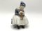 Porcelain Figurine of a Sewing Woman from Royal Copenhagen, Denmark 1