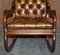 Hand Carved Chesterfield Brown Leather Rocking Armchair, 1900s 8