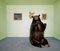 Matthias Clamer, Black Bear Sitting Up on Rug in Living Room, Photographic Paper 1