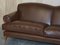 Large Contemporary Solid Brown Sofa with Brass Castors in the Style of Howard & Sons 3