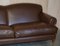 Large Contemporary Solid Brown Sofa with Brass Castors in the Style of Howard & Sons 4