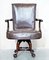 Antique Brown Leather Swivel Captains Chair with Claw & Ball Feet from Thomas Chippendale 3