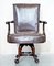Antique Brown Leather Swivel Captains Chair with Claw & Ball Feet from Thomas Chippendale, Image 3
