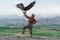 Oleh_slobodeniuk, Eagle Hunter in piedi sullo sfondo delle montagne in Kirghizistan, carta fotografica, Immagine 1