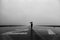 Tim Bieber, Lone Person With Umbrella in the Rain on Runway, Photographic Paper 1