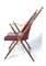 Sedia pieghevole in simil bambù con borchie in ottone, seduta imbottita in pelle rossa e supporti in ottone di Maison Mercier, Immagine 2