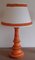 Lampada da tavolo vintage con base in ceramica arancione e paralume in tessuto bianco crema di Aro Lights, Germania, anni '70, Immagine 1