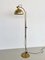 Lámpara de pie regulable Mid-Century de latón macizo de Florian Schulz, años 70, Imagen 1