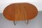 Round Teak Veneered Dining Table with Central Extension, 1960s 3