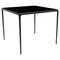 90 Xaloc Chocolate Glass Top Table from Mowee 1