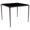 90 Xaloc Chocolate Glass Top Table from Mowee, Image 1