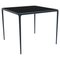90 Xaloc Navy Glass Top Table from Mowee 1