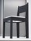 01 Stuhl aus schwarzem Eschenholz mit weißem Bouclé Sitz und Bronze Details von barh.design 2