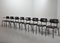 Sedie da pranzo in similpelle nera con struttura in acciaio di Ahrend De Cirkel, Paesi Bassi, anni '60, set di 8, Immagine 1