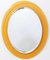 Oval Beveled Wall Mirror with Orange Glass Frame in the style of Fontana Arte, 1960s 1