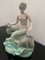Bicauda Meerjungfrau mit Muschel auf Felsen und mythologischen Fischen 1
