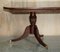 Flamed Mahogany & Walnut Based Tripod Extending Dining Table with Brass Castors 4