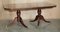 Flamed Mahogany & Walnut Based Tripod Extending Dining Table with Brass Castors 17