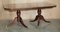 Flamed Mahogany & Walnut Based Tripod Extending Dining Table with Brass Castors, Image 17