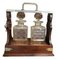 20th Century Cut Glass Decantars and Stoppers on Wood Metal and Brass Framed Tantalus, Set of 3, Image 1