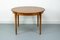 Round Teak Veneered Dining Table with Central Extension, 1960s, Image 1