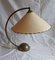 Vintage Swivel Table Lamp with Arched Brass Frame and Cream-Colored Shade, 1960s, Image 1