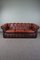 Geschwungenes rotes Chesterfield Ledersofa 1