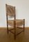 Sedia vintage nordamericana in legno rustico con schienale e seduta intrecciati, Immagine 1
