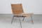 Sessel mit Metallgestell und Geflochtenem Rohr im Stil von Poul Kjærholm, Dänemark, 1960er 1