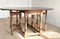 Solid Oak Dining Table with Folding Mechanism and Turned Legs, 1900s, Image 1