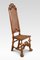Antiker Stuhl mit hoher Rückenlehne aus Nussholz, 1890er 1