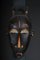 Antike Maske aus geschnitztem Holz 2