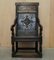 17th Century English Jacobean Hand Carved Oak Armchair with Tudor Panelling 2