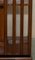 Burr Walnut & Satinwood Revolving Bookcases with Sheraton Revival Inlaid, 1920s 11