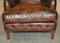 Bridgewater Brown Leather Armchairs & Footstool from Howard & Sons, 1880s, Set of 3 8