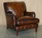 Bridgewater Brown Leather Armchairs & Footstool from Howard & Sons, 1880s, Set of 3 5