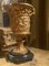 French 18th Century Louis XVI Ormolu Vases with Handles and Relief Putto on Black Belgian Marble Bases, Set of 2, Image 4