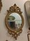 Französischer Ovaler Spiegel mit geschnitztem Stuckrahmen aus vergoldetem Holz, 1800er 3