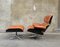 Poltrona e poggiapiedi in compensato e pelle marrone chiaro di Charles & Ray Eames per Herman Miller, anni '60, set di 2, Immagine 1