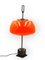 Tischlampe aus orangefarbenem Glas von Oscar Torlasco für Lumi, 1960er 15