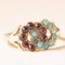 8 Karat Yellow Gold Infinity Ring with Turquoises and Garnets, Late 1800s-Early 1900s 8