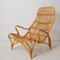 Swedish Modern Rattan Lounge Chairs and Footstool attributed to Bruno Mathsson for Dux, 1970s, Set of 3, Image 11