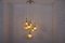 Kaskadenlampe aus Messing mit Bernsteinfarbenen Kugelschirmen, 1950er 2