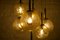 Kaskadenlampe aus Messing mit Bernsteinfarbenen Kugelschirmen, 1950er 9