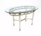 Vintage Brass Coffee Table with Oval Glass Top in the style of Pierluigi Colli, Italy, 1950s 1