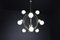 Mid-Century Chandelier in Brass and 12 Opaline Globes from Stilnovo, Italy 1950s 6