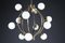 Mid-Century Chandelier in Brass and 12 Opaline Globes from Stilnovo, Italy 1950s 10