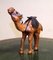 Vintage Aged Leather Camel Sculpture on Hand Carved Wood from Libertys 1
