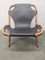 Vintage Relaxation Armchair in Rattan with Black Leather Seat, 1960s, Image 1
